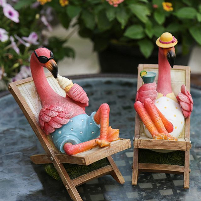 Funny figurines of pink flamingos