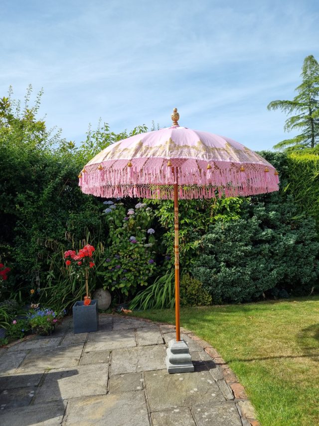 Pink parasol with fringes