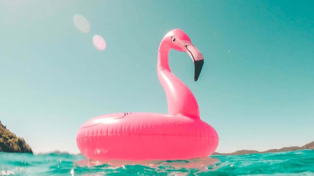 Inflatable pink flamingo - an indispensable attribute